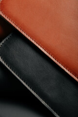 Close up of two leather handmade pieces