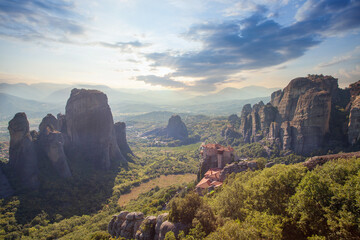 Fototapeta premium Wonderful Panoramic view of Meteora valley. Sunny landscape with colorful sky over the mountain valley in Greece, Europe