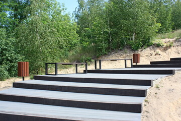 Benches / park bench and garbage can in a modern style. A new viewpoint on the Odra-Widuchowa backwaters, West Pomeranian Voivodeship, Poland