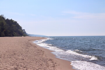 sandy sea beach on the Baltic Sea on a sunny day, Dziwnów, Poland