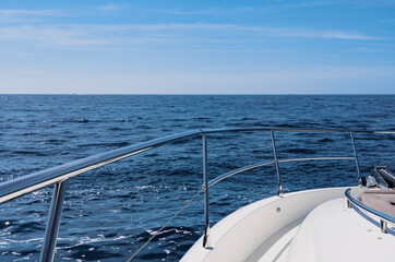 Naklejka na ściany i meble Luxury motor yacht in the azure Mediterranean sea at full speed.Expensive yacht.