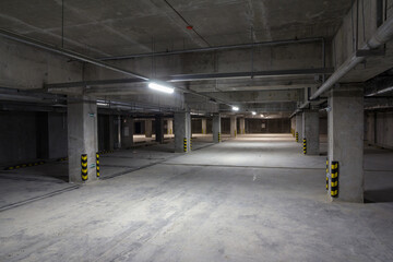 Empty underground parking. Free parking spaces. Alternative parking. Parking for cars within the...