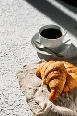 delicious fresh French croissants with cup of coffee  