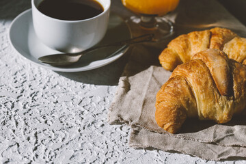 delicious fresh French croissants with cup of coffee  