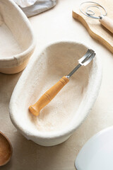 Rattan banneton, proofing basket for sourdough bread. Baking utensile. Basic set of baking bread at home.