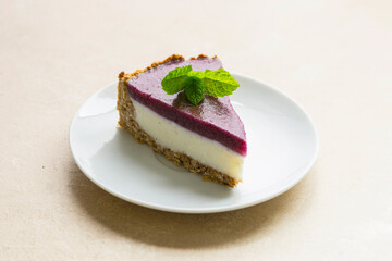 Cheesecake with berries and green mint. Gluten and sugar free vegan, healthy cake.