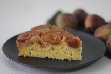 Slice of Fig upside down cake with lots of fresh figs and flavored with fresh orange juice.