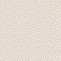 Vintage Polka Dot seamless pattern. White irregular spots, scattered various shape specks on beige background. Abstract vector texture for nursery print design, fashion textile, fabric, scrapbooking