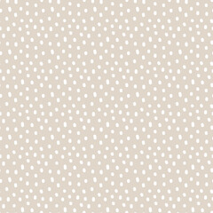 Vintage Polka Dot seamless pattern. White irregular spots, scattered various shape specks on beige background. Abstract vector texture for nursery print design, fashion textile, fabric, scrapbooking