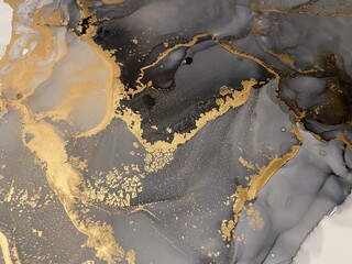Abstract grey background with gold — beautiful smudges and stains made with alcohol ink and golden paint. Fragment of art with black and white texture resembles marble, watercolor or aquarelle.

