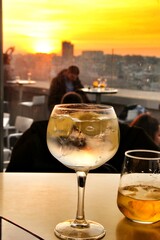 Glasses of Gin tonic on table in Spain at sunset