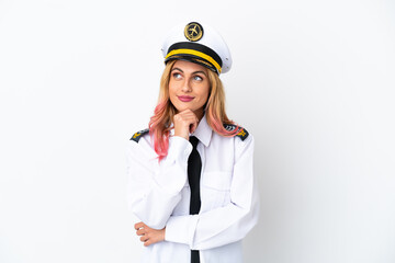 Airplane pilot over isolated white background and looking up