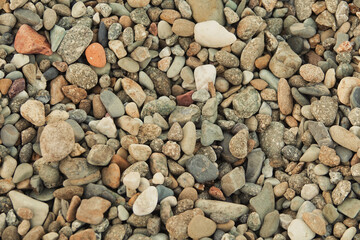 Colorful stone wall background on the beach