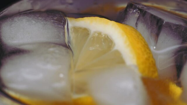 Close up of glass water with lime, lemon. Soda with sliced lemon and ice for detox. concept of freshness.