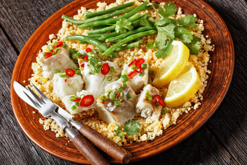cod with bulgur, steamed green beans, top view