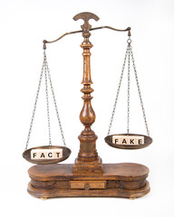 scale with the words fact and fake as symbol for the difference of both, Fact counts more