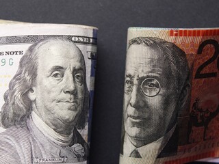 economy and finance with australian and american dollar money
