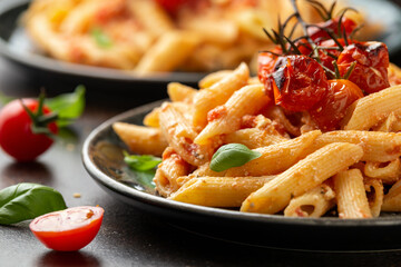Baked sweet cherry tomatoes and Greek feta cheese fussily pasta. Trendy Vegetarian food