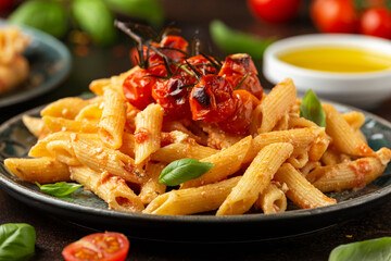 Baked sweet cherry tomatoes and Greek feta cheese fussily pasta. Trendy Vegetarian food