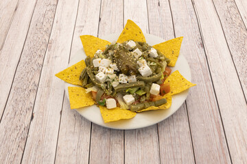 Great Mexican nopales salad with cheese, tomato, lettuce, chopped fresh cheese and yellow corn...