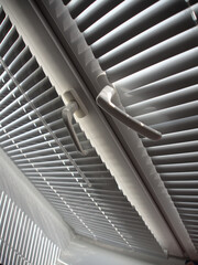 Obraz premium covered white blinds on the window