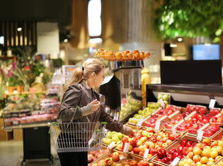 Woman buying fruits at the market