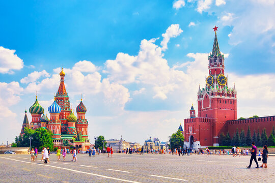 Moscow landscape. Red Square with Spasskaya Tower of the Moscow Kremlin and St. Basil's Cathedral. Summer sunny day