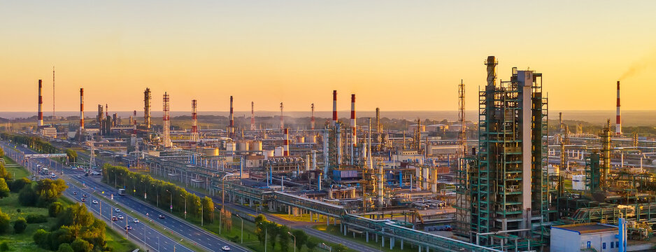 Aerial drone view of petrol industrial zone or oil refinery in Yaroslavl, Russia during sunset time. Banner wide format