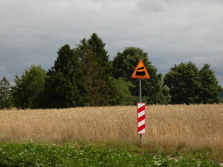 Rural landscape with railway crossing sign, Pomorskie province, Poland
