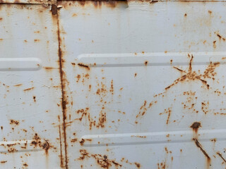 Gray old scratched sheet of metal, iron rusty surface with peeling paint. The background. Texture
