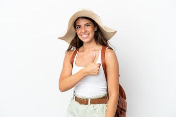 Young caucasian woman wearing a Pamela in summer holidays isolated on white background giving a thumbs up gesture