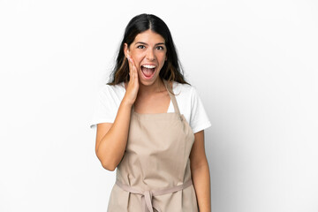 Restaurant waiter over isolated white background with surprise and shocked facial expression