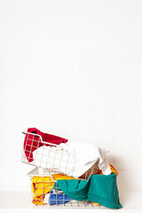 Pile of dirty, colorful laundry in baskets. 