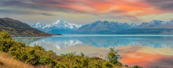 Scenic reflection of Mount Sefton and Mount Cook at lake Pukaki, New Zealand