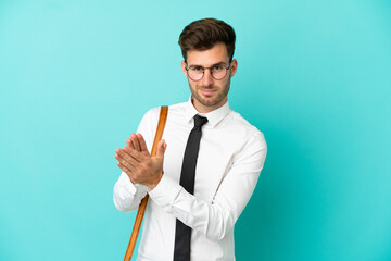 Business man over isolated background applauding after presentation in a conference