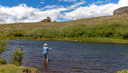 Fototapeta na wymiar Man Fly -Fishing On The Rio Grande River In Colorado