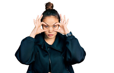 Young hispanic girl wearing sportswear trying to open eyes with fingers, sleepy and tired for morning fatigue