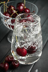 Fresh juicy cherries. Red cherry on a dark background. Macro photo.