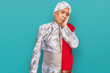 Senior hispanic man wearing tradition sherwani saree clothes thinking looking tired and bored with depression problems with crossed arms.