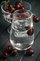 Fresh juicy cherries. Red cherry on a dark background. Macro photo.