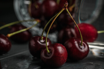 juicy ripe cherry close-up. Red cherry. macro photo. Still life on a dark background.