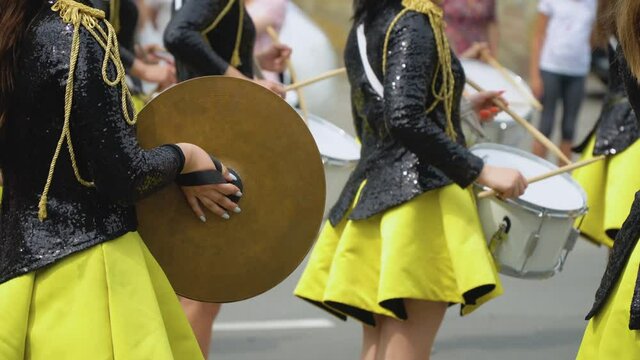 Young girls drummer at the parade. Street performance