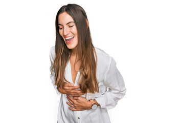 Young beautiful woman wearing casual clothes smiling and laughing hard out loud because funny crazy...