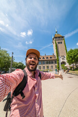 happy tourist man taking a selfie photo in Zurich, Switzerland - obrazy, fototapety, plakaty