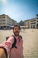 Obraz premium happy tourist man taking a selfie photo in Zurich, Switzerland