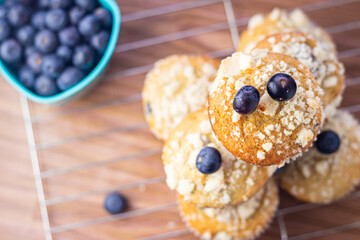 Overhead Closeup of Stacked Blueberry Muffins on a Cooling Rack