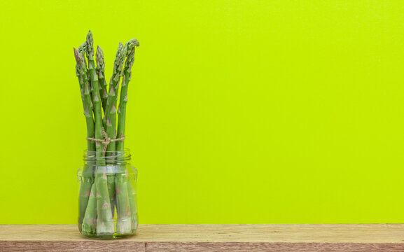 asparagus stored in water to preserve it longer. Good food storage to reduce home waste. with copy space