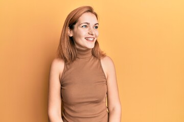 Obraz premium Young caucasian woman wearing casual style with sleeveless dress looking to side, relax profile pose with natural face and confident smile.