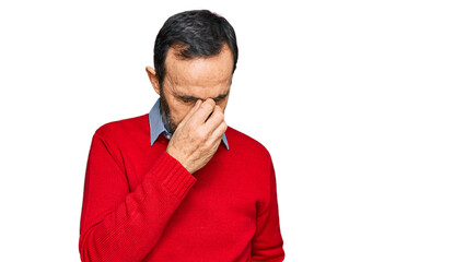 Middle age hispanic man wearing casual clothes tired rubbing nose and eyes feeling fatigue and headache. stress and frustration concept.