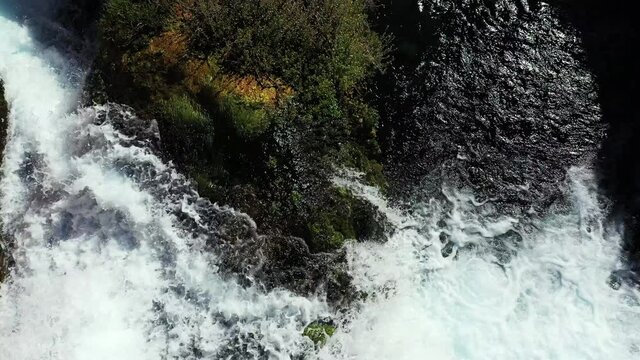 Aerial View of Top of Waterfall in Wilderness on Sunny Summer Day, Freshwater in Nature, Drone Shot
